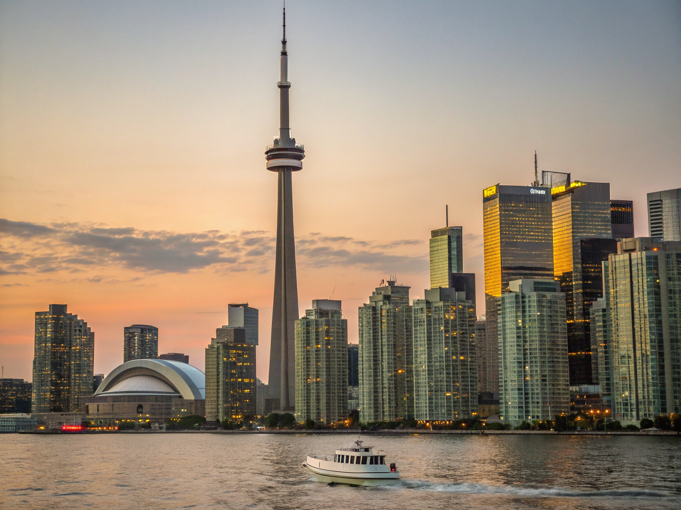 Panoramic view of downtown Toronto skyline and waterfront at twilight
